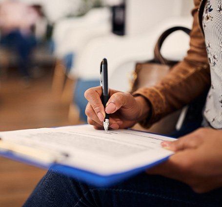 Patient filling out form in lobby