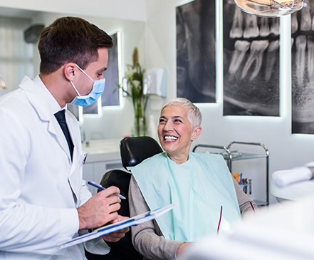 Patient smiling at dentist during appointment