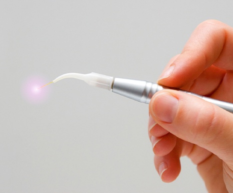 Handheld soft tissue laser dentistry tool