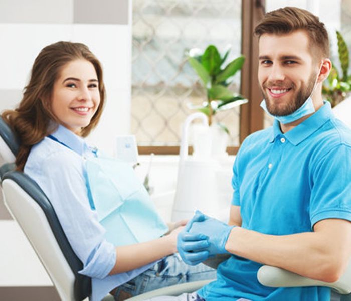 a patient examining an X-ray of his wisdom teeth in Spring